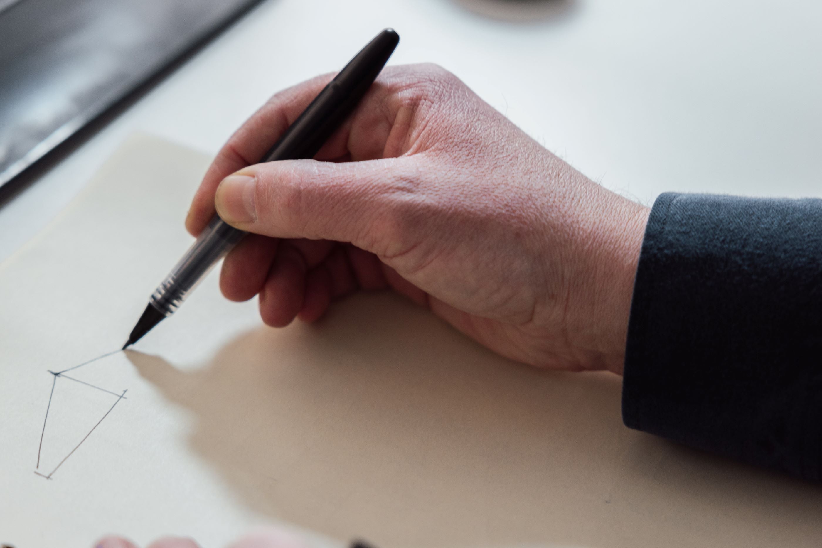 Designer sketching an initial custom product concept