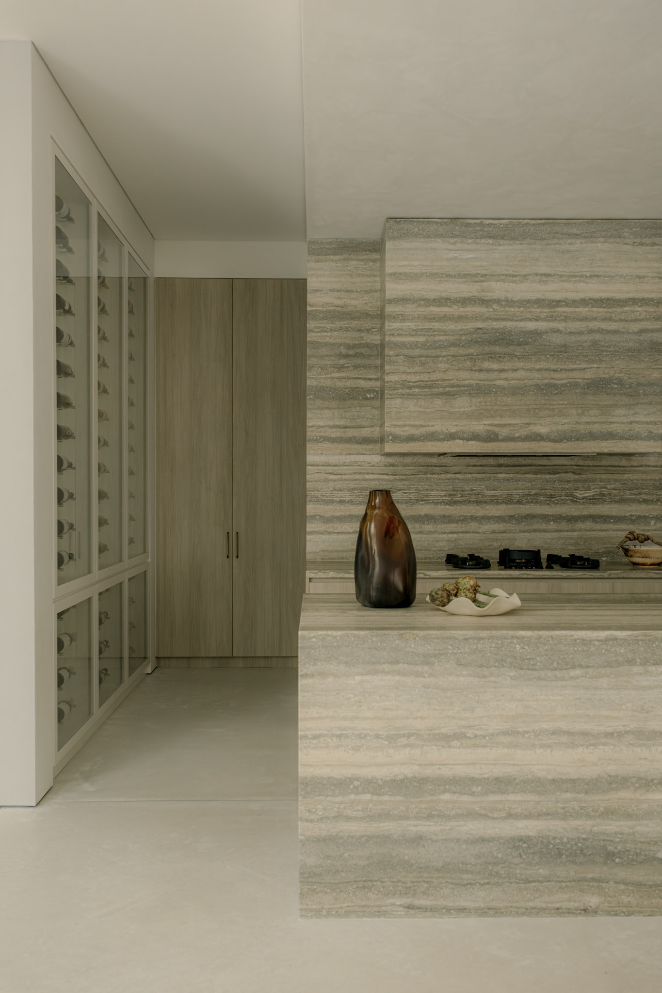 Striated natural stone countertop with matching splashback