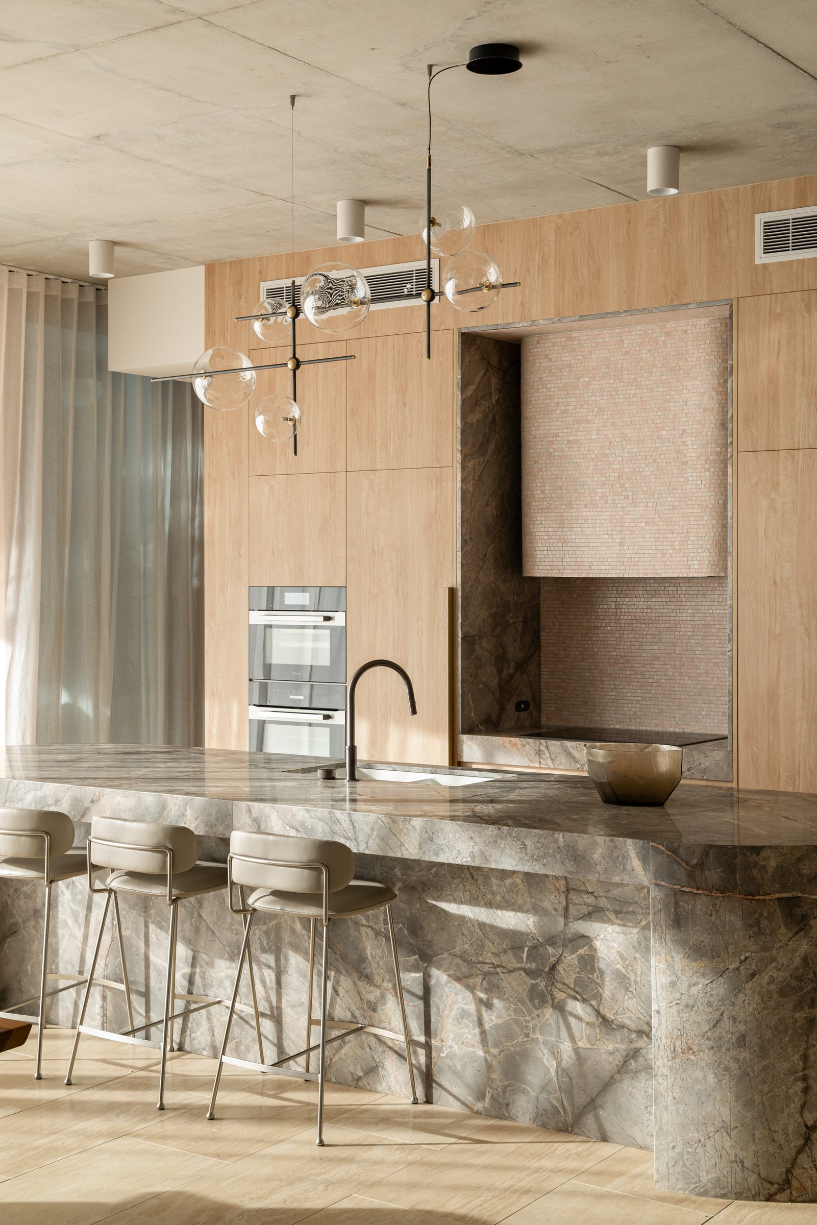 Natural stone kitchen island with detailed edge profile