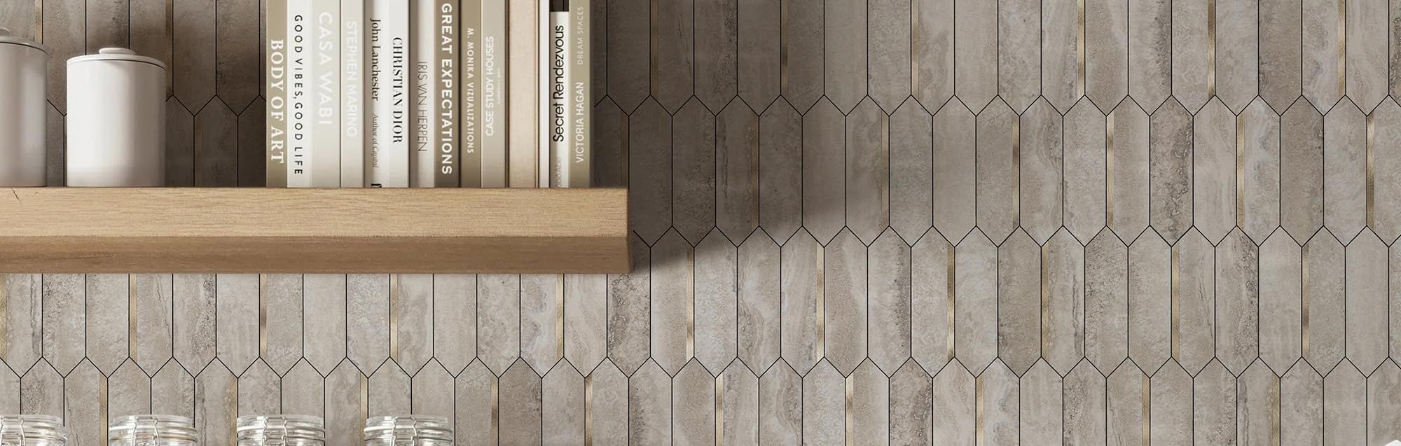 Neutral stone mosaic wall with shelf and books