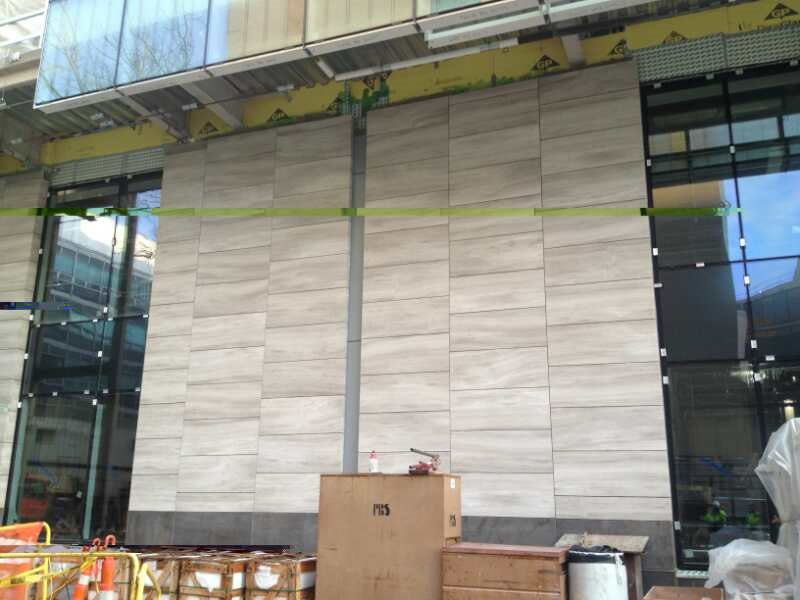 White wooden marble facade panel installation detail
