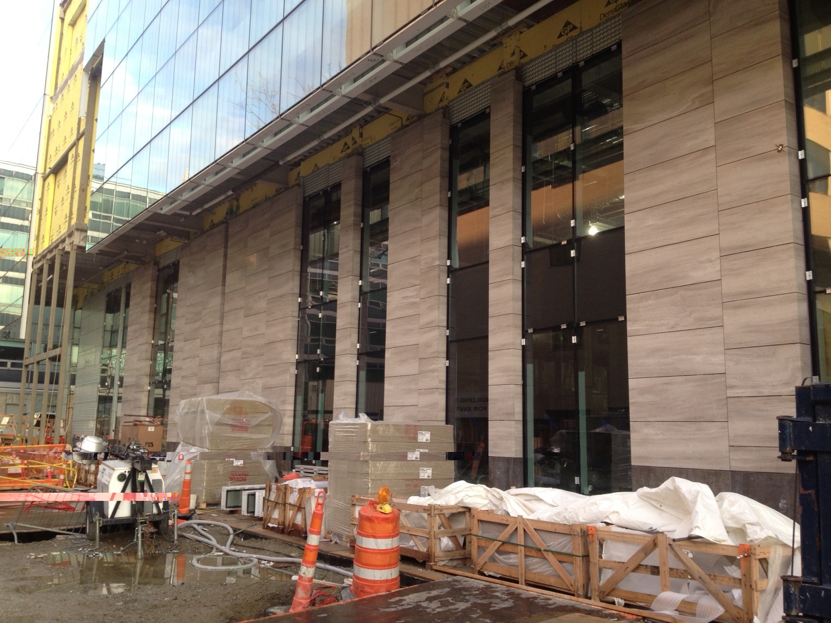 Natural stone facade at the Massachusetts Institute of Technology project site