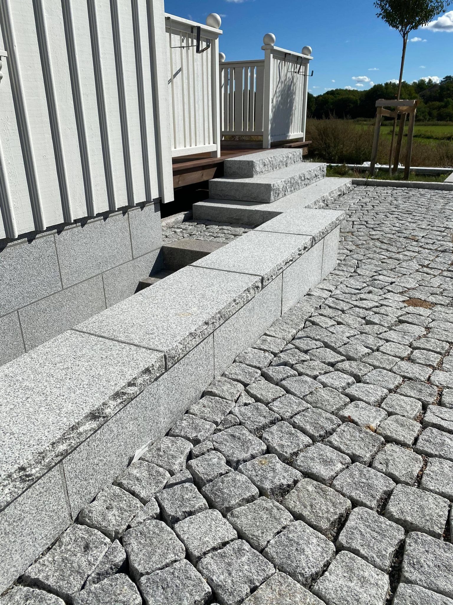 Granite steps and cobblestone paving