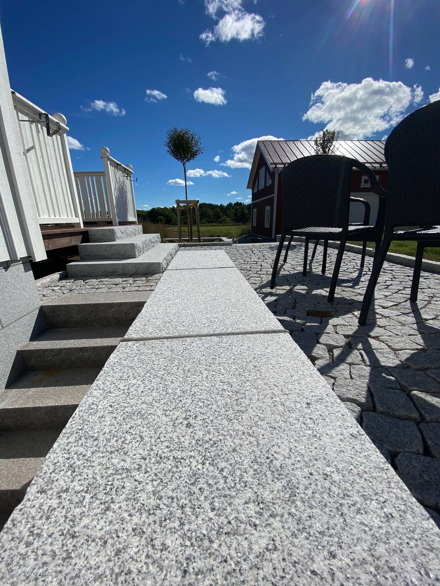 Granite terrace paving and entrance steps at the Sweden residence